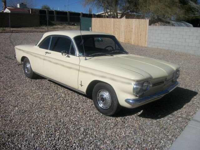 yellow 1962 Chevrolet Corvair coupe with Black interior
