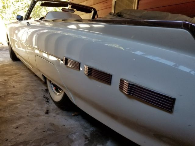 White 1962 Ford Thunderbird with Red interior