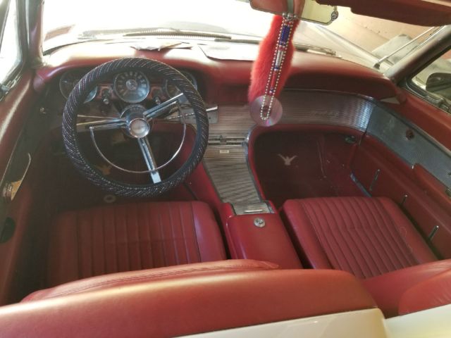 White 1962 Ford Thunderbird with Red interior