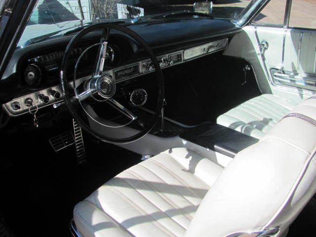 Blue 1963 Ford Galaxie Convertible with white interior