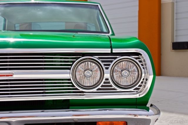 Green 1965 Chevrolet Malibu Coupe with White interior