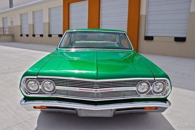 Green 1965 Chevrolet Malibu Coupe with White interior