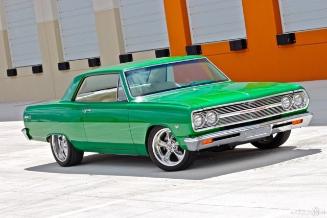 Green 1965 Chevrolet Malibu Coupe with White interior