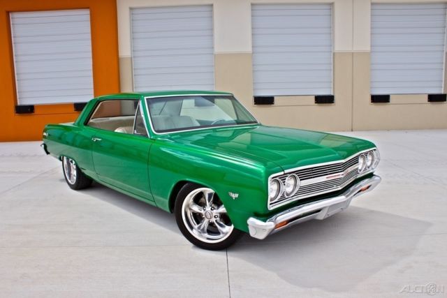 Green 1965 Chevrolet Malibu Coupe with White interior