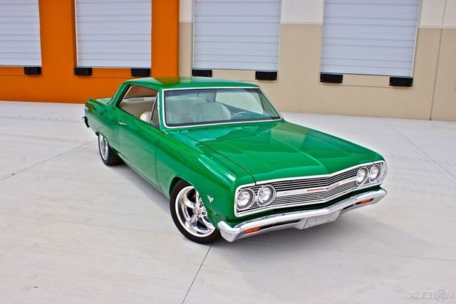 Green 1965 Chevrolet Malibu Coupe with White interior