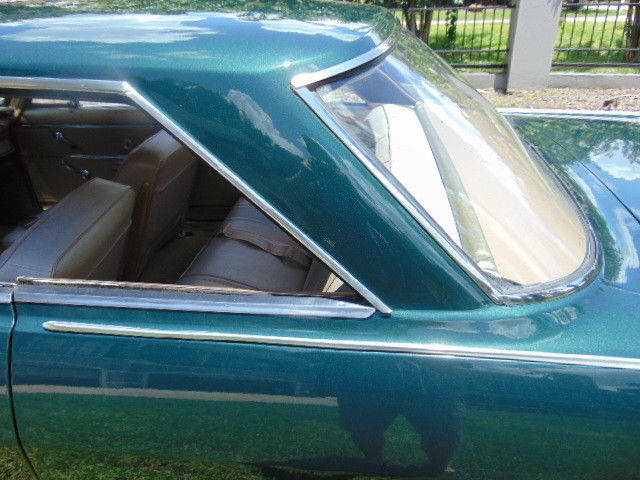 Green 1965 Chevrolet Nova Coupe with Tan interior