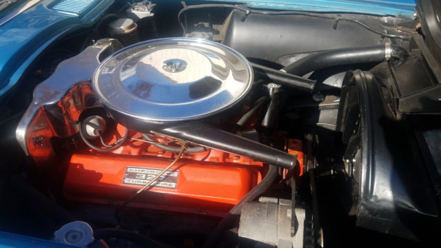 Blue 1965 Chevrolet Corvette with White interior