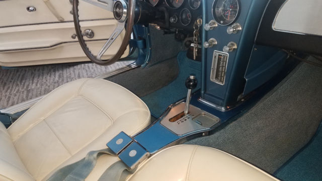 Blue 1965 Chevrolet Corvette with White interior