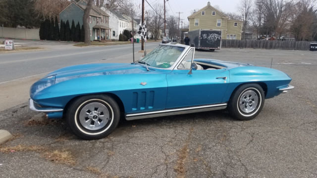 Blue 1965 Chevrolet Corvette with White interior