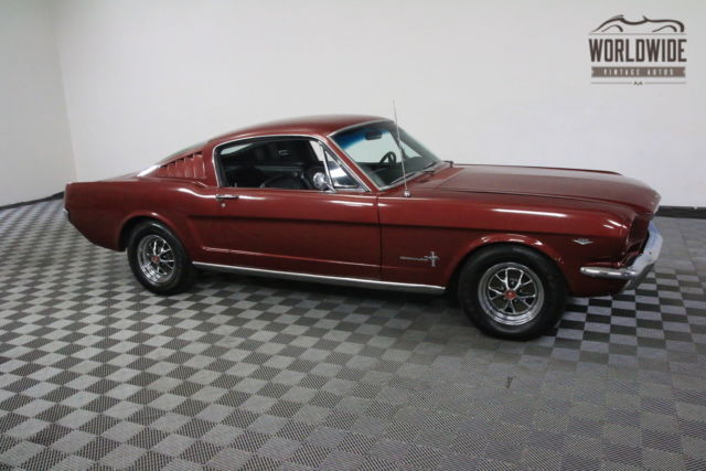 Red 1965 Ford Mustang with Black interior