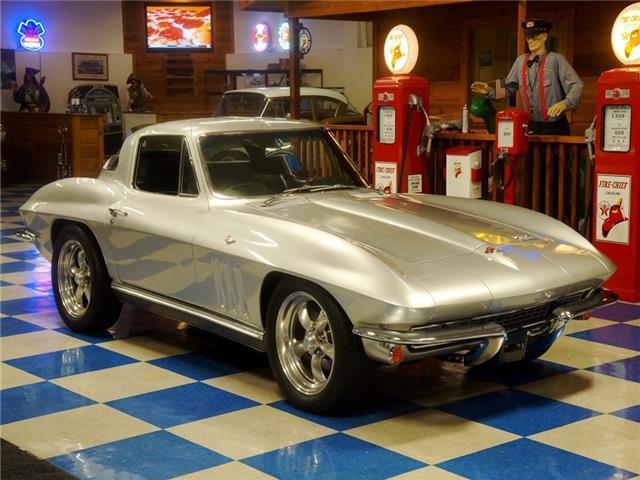 Silver 1966 Chevrolet Corvette -- with Black interior