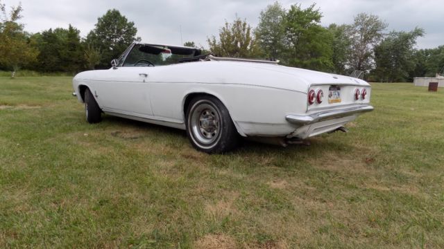 white 1966 Chevrolet Corvair Convertible with black interior