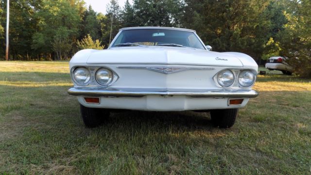 white 1966 Chevrolet Corvair Convertible with black interior