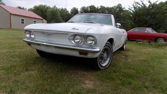 white 1966 Chevrolet Corvair Convertible with black interior