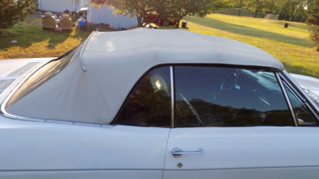 white 1966 Chevrolet Corvair Convertible with black interior