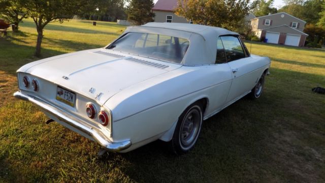 white 1966 Chevrolet Corvair Convertible with black interior