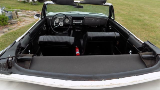 white 1966 Chevrolet Corvair Convertible with black interior