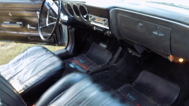 white 1966 Chevrolet Corvair Convertible with black interior