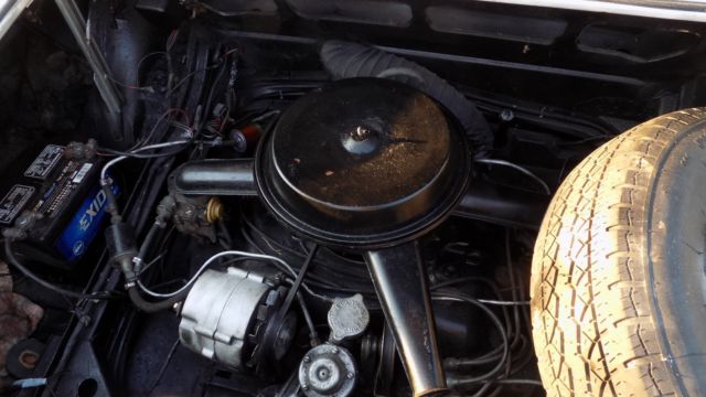 white 1966 Chevrolet Corvair Convertible with black interior