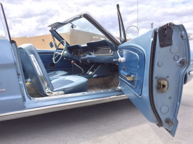 blue 1966 Ford Mustang with blue interior
