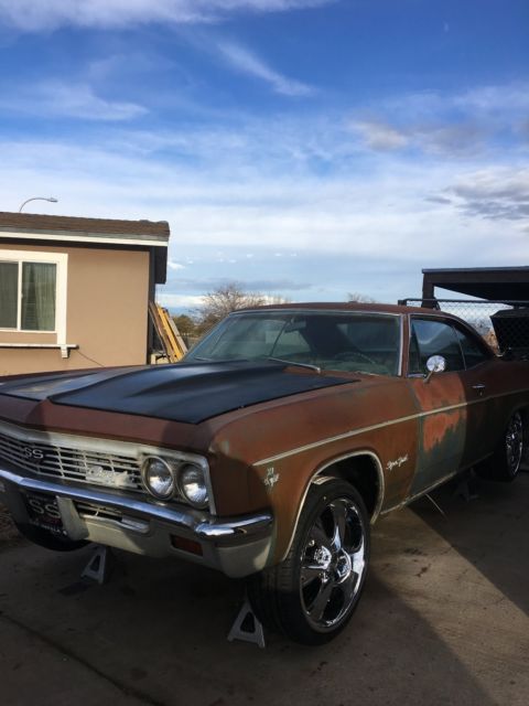 Rust brown gold 1966 Chevrolet Impala Coupe with Blue interior