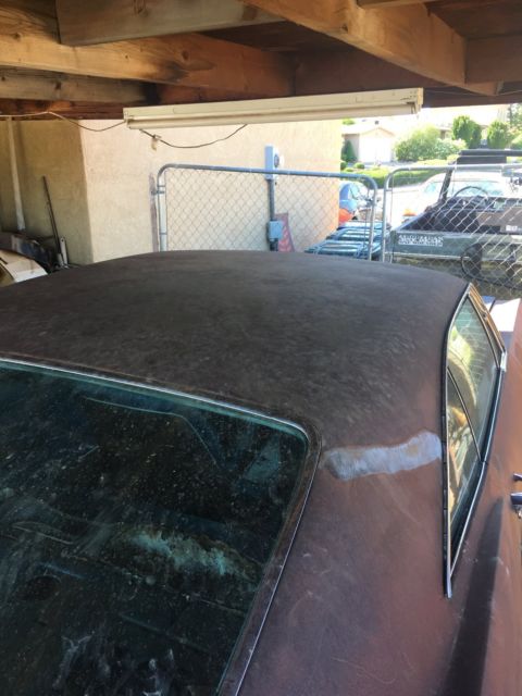 Rust brown gold 1966 Chevrolet Impala Coupe with Blue interior