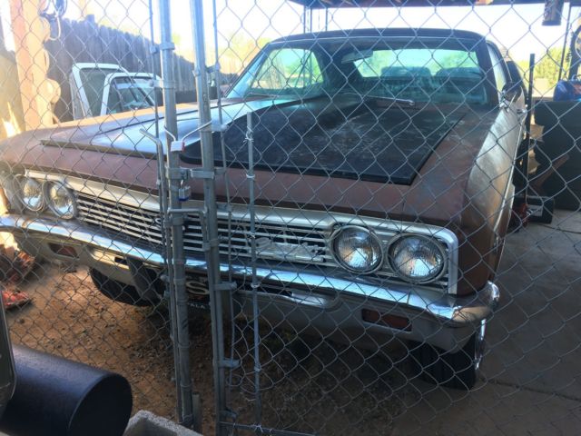 Rust brown gold 1966 Chevrolet Impala Coupe with Blue interior