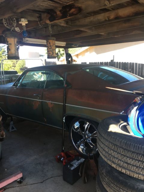 Rust brown gold 1966 Chevrolet Impala Coupe with Blue interior