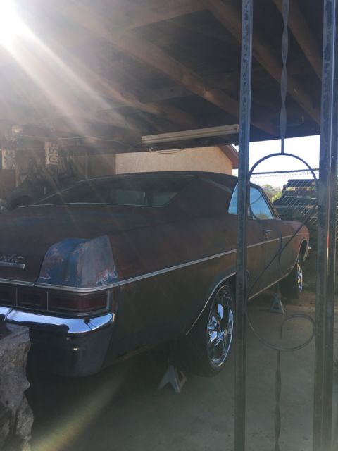 Rust brown gold 1966 Chevrolet Impala Coupe with Blue interior
