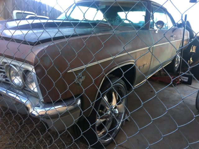 Rust brown gold 1966 Chevrolet Impala Coupe with Blue interior