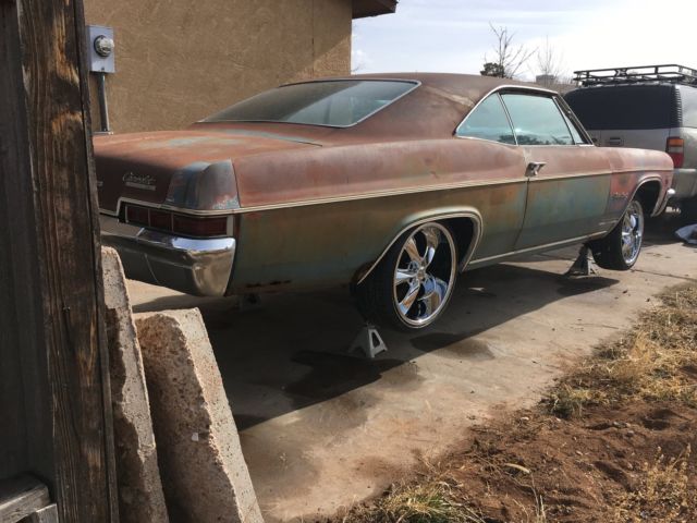 Rust brown gold 1966 Chevrolet Impala Coupe with Blue interior