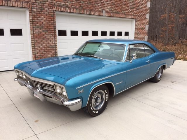 Marina Blue 1966 Chevrolet Impala Coupe with Ivory interior