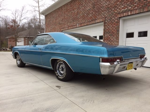 Marina Blue 1966 Chevrolet Impala Coupe with Ivory interior