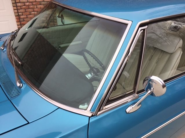 Marina Blue 1966 Chevrolet Impala Coupe with Ivory interior