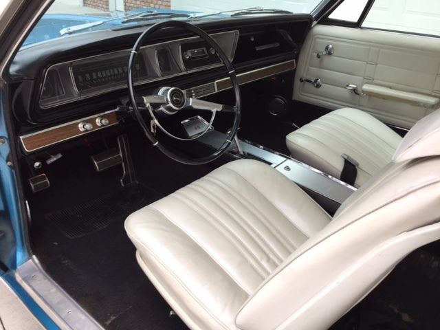 Marina Blue 1966 Chevrolet Impala Coupe with Ivory interior