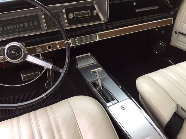Marina Blue 1966 Chevrolet Impala Coupe with Ivory interior