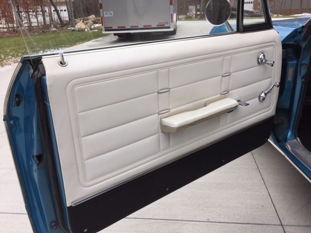 Marina Blue 1966 Chevrolet Impala Coupe with Ivory interior
