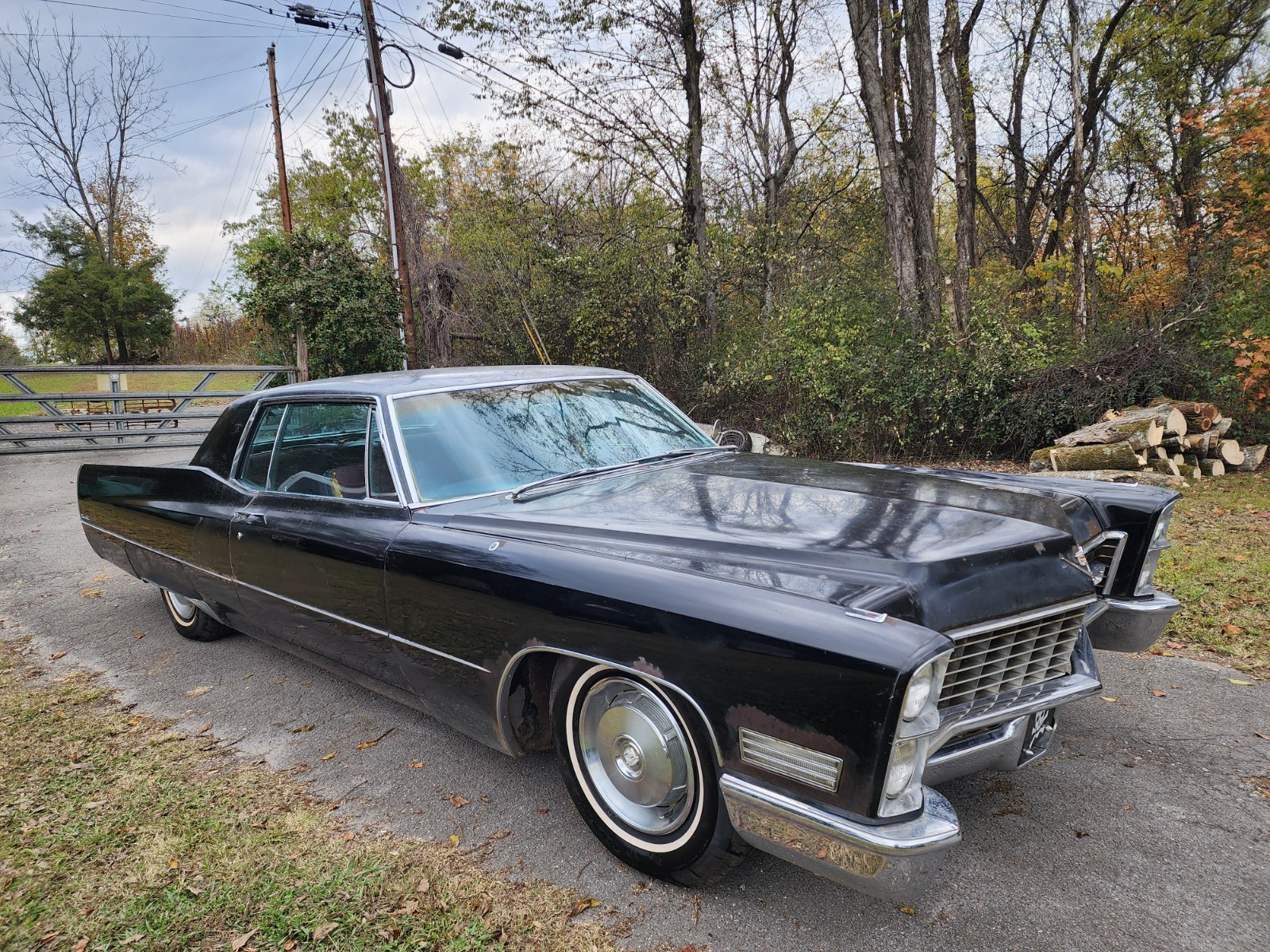 Black 1967 Cadillac DeVille Coupe with Burgundy interior