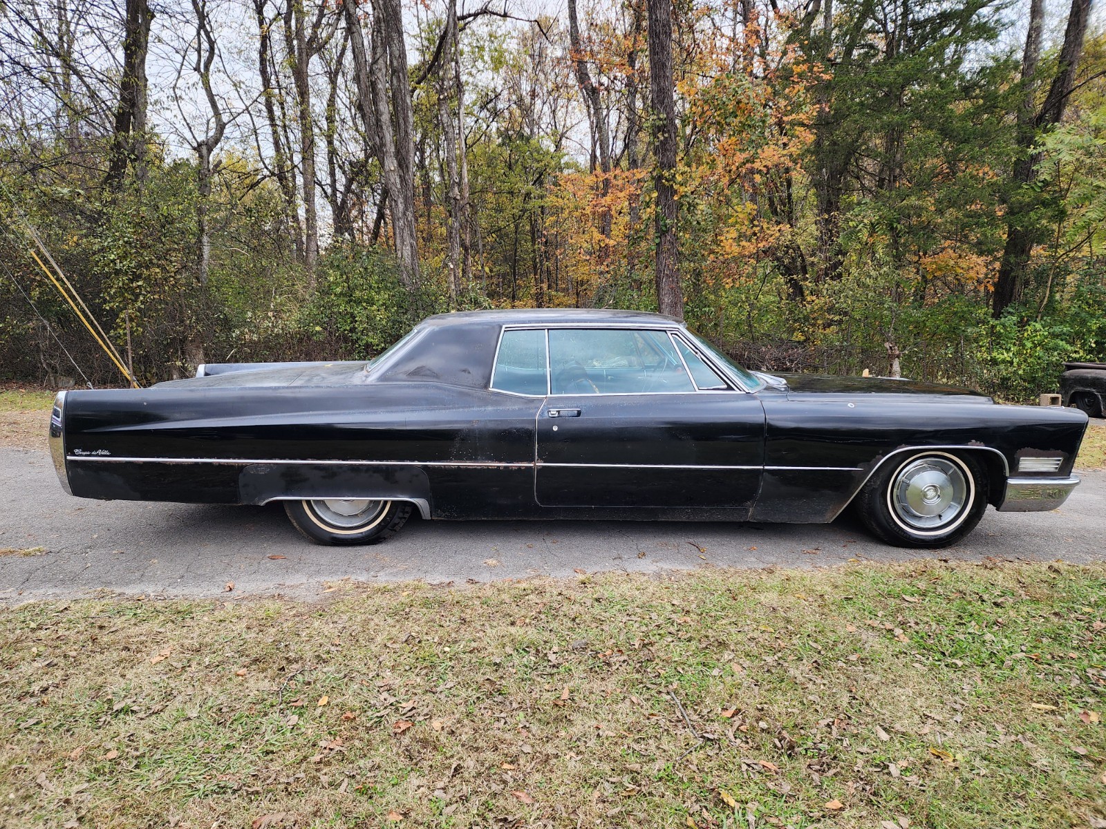 Black 1967 Cadillac DeVille Coupe with Burgundy interior