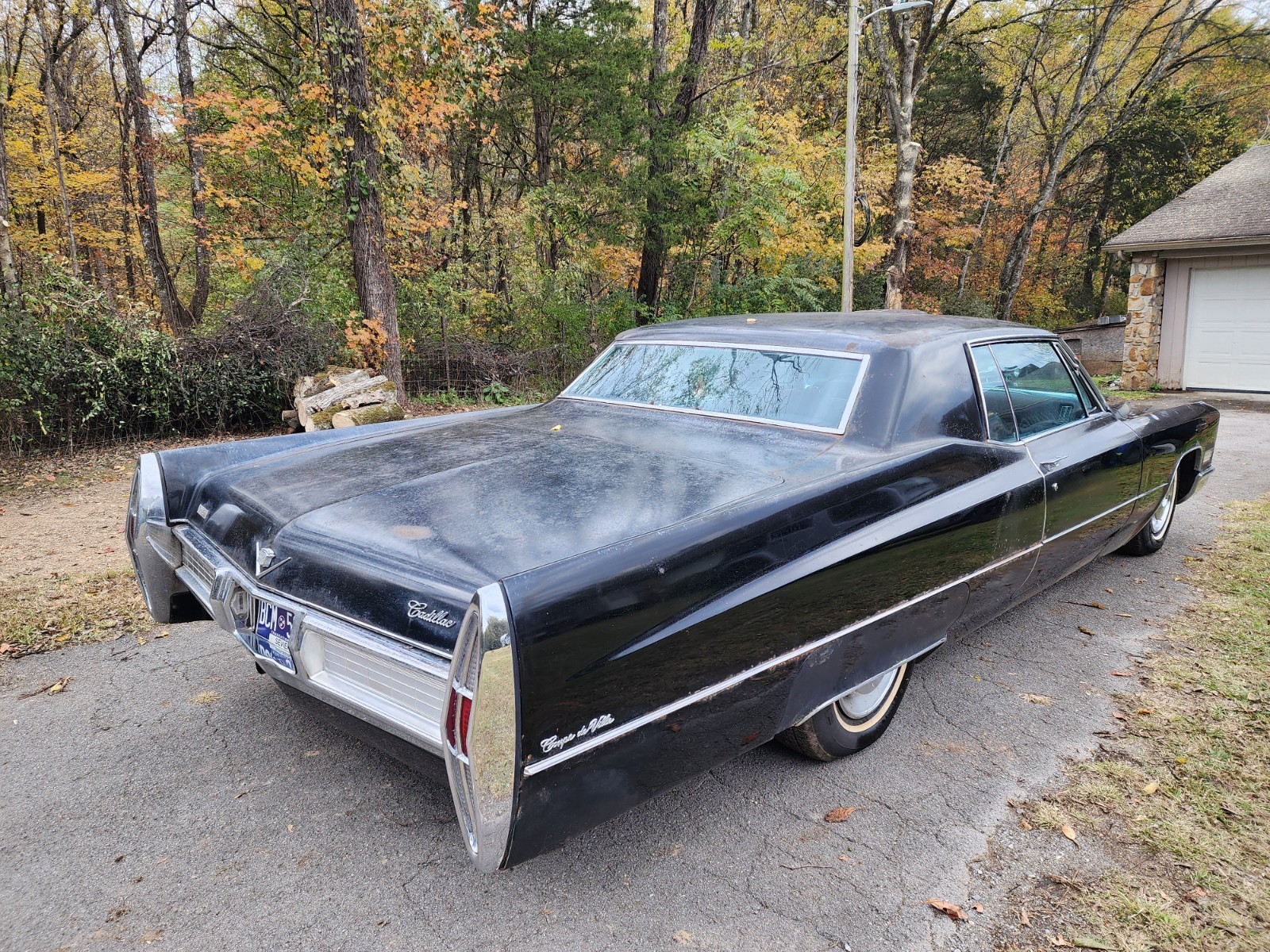 Black 1967 Cadillac DeVille Coupe with Burgundy interior