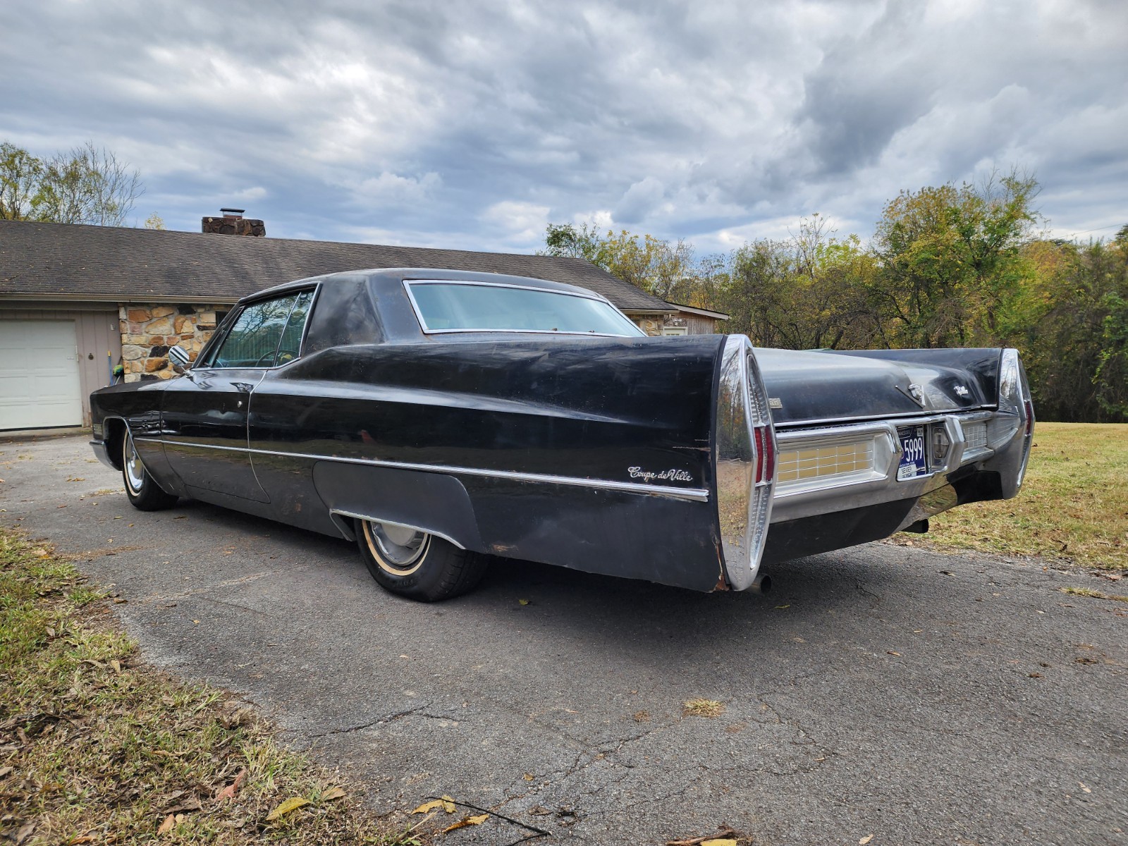 Black 1967 Cadillac DeVille Coupe with Burgundy interior