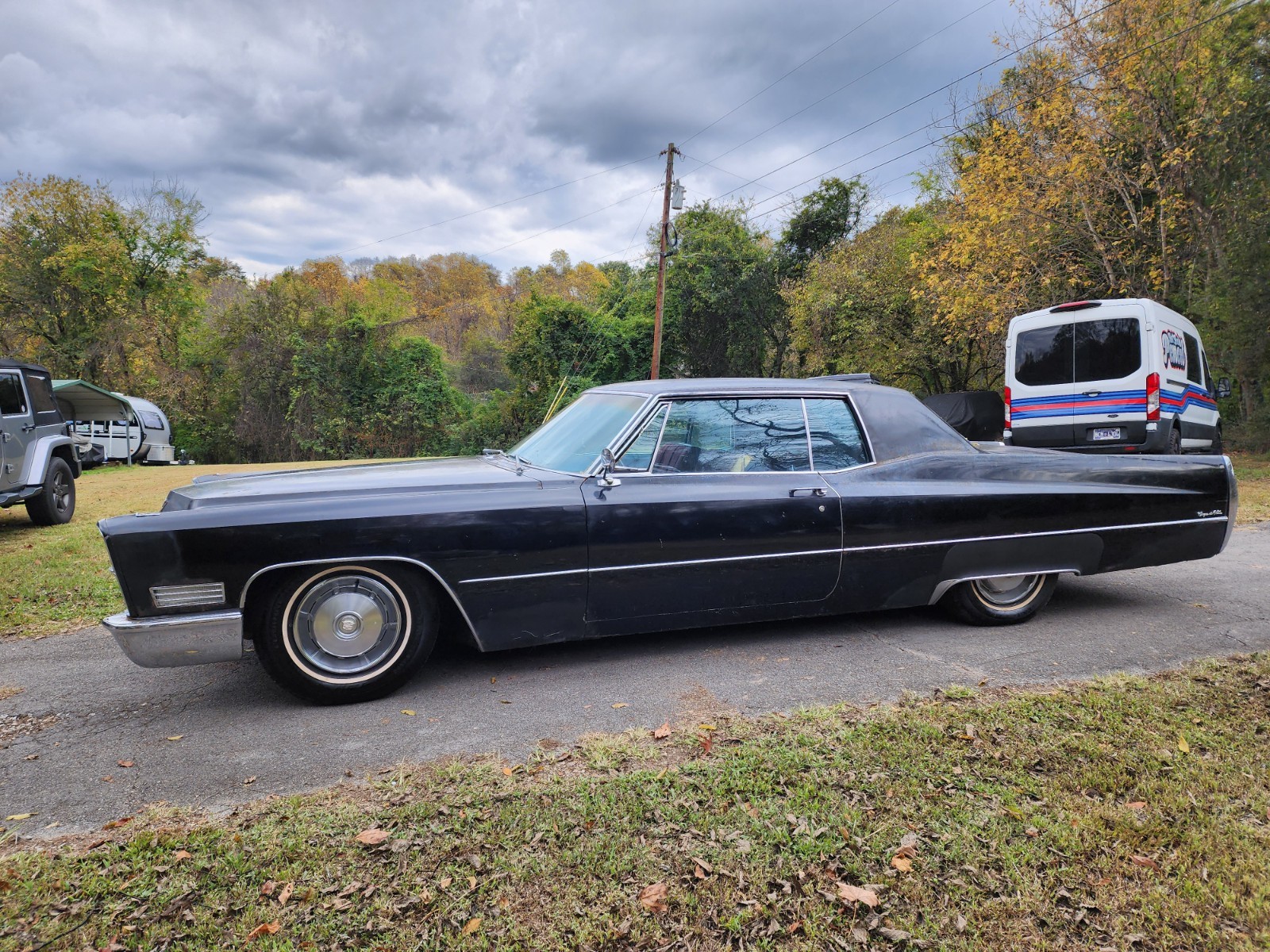 Black 1967 Cadillac DeVille Coupe with Burgundy interior