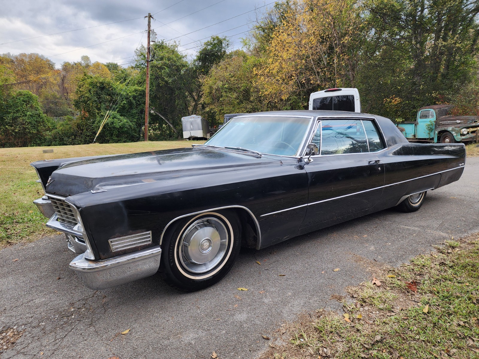 Black 1967 Cadillac DeVille Coupe with Burgundy interior
