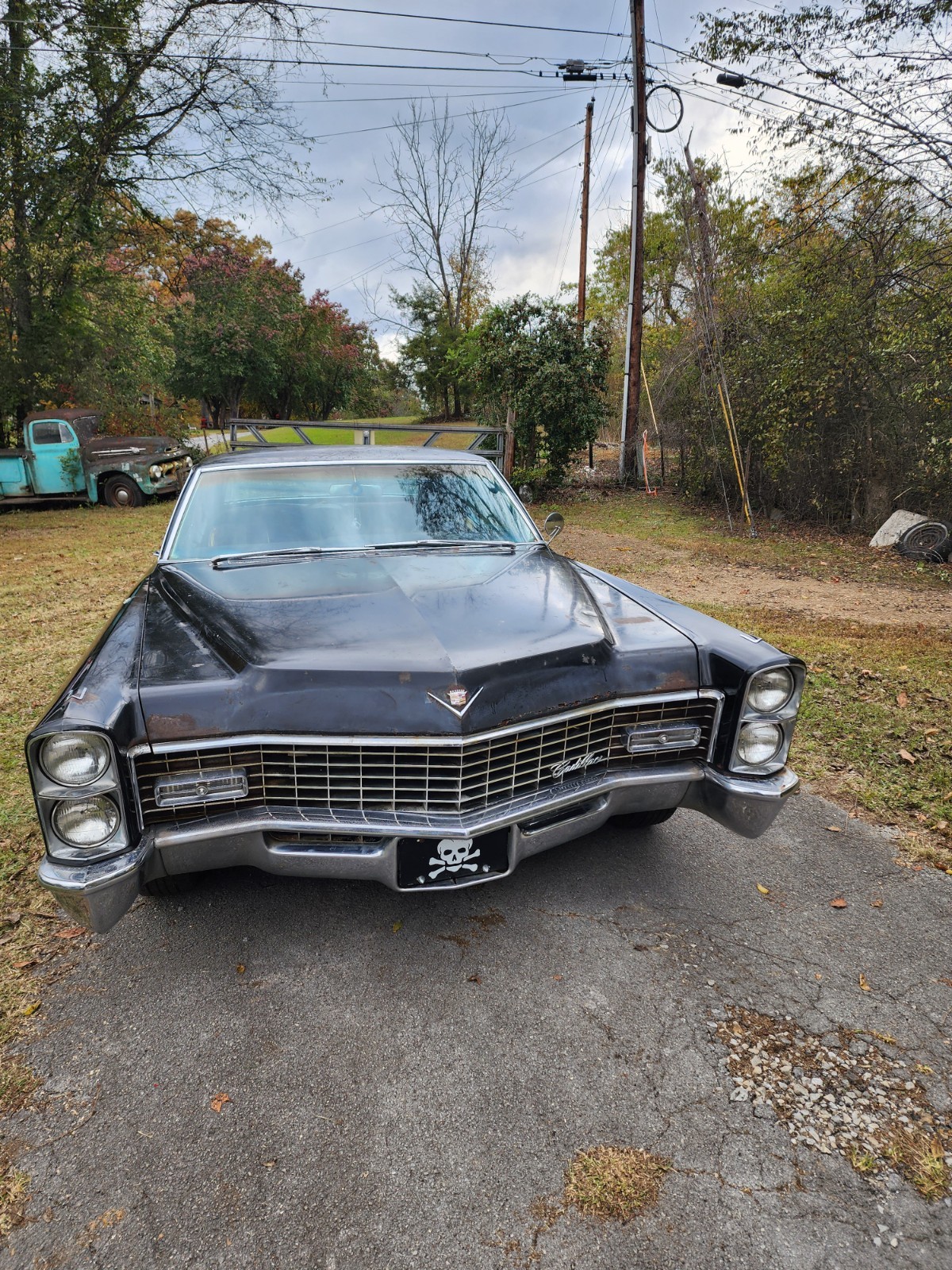 Black 1967 Cadillac DeVille Coupe with Burgundy interior