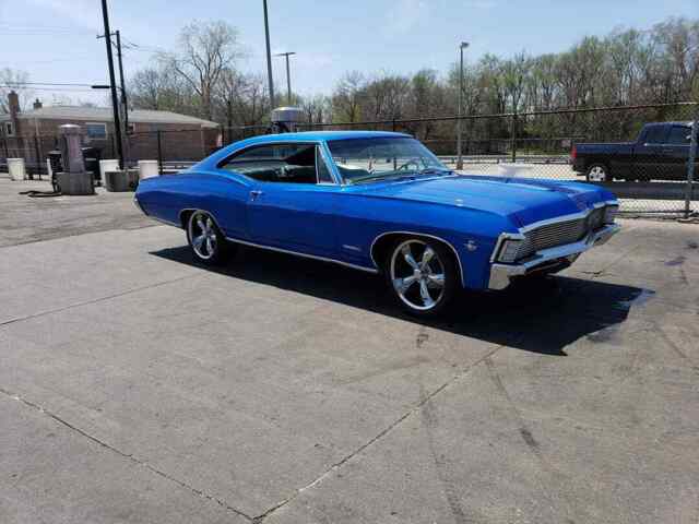 Blue 1967 Chevrolet Impala Coupe with Black interior