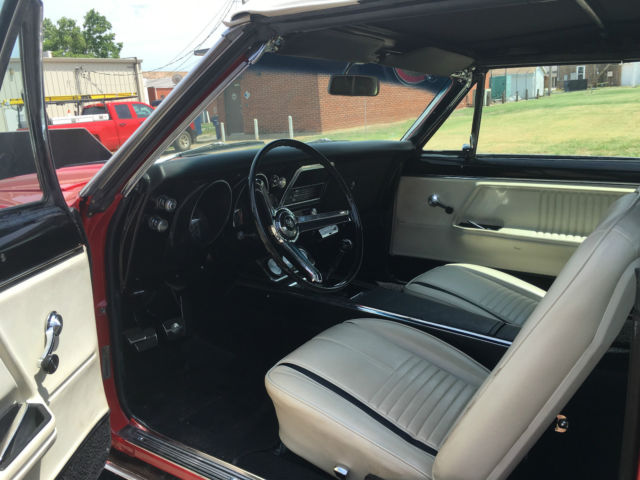 Red 1967 Chevrolet Camaro with White interior