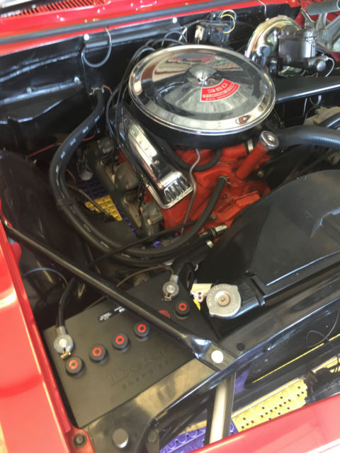 Red 1967 Chevrolet Camaro with White interior