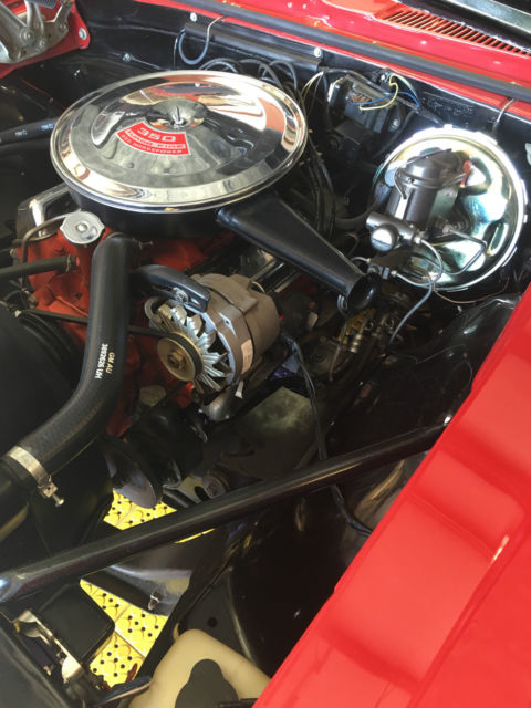 Red 1967 Chevrolet Camaro with White interior