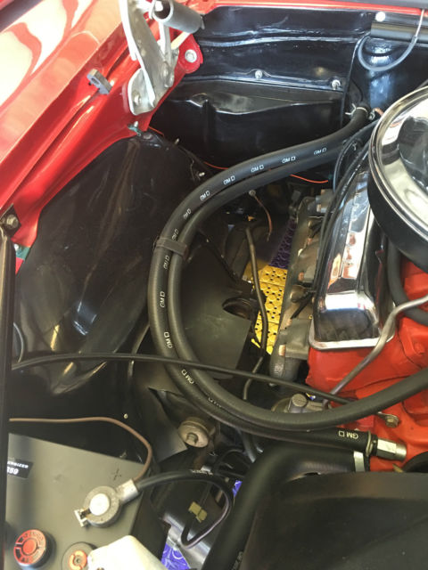 Red 1967 Chevrolet Camaro with White interior