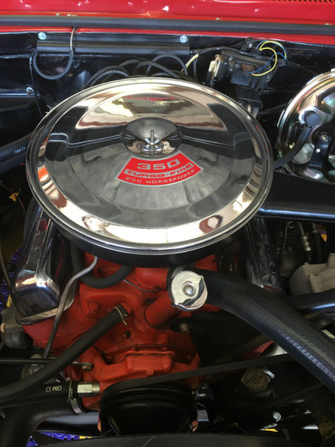 Red 1967 Chevrolet Camaro with White interior